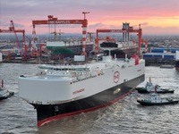 The car carrier ''BYD Changzhou'' departs with the assistance of a tugboat at CIMC Raffles' Shandong Longkou construction base in Yantai, Ch...