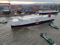 The car carrier ''BYD Changzhou'' departs with the assistance of a tugboat at CIMC Raffles' Shandong Longkou construction base in Yantai, Ch...