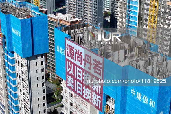 A large ''trade-in'' advertisement hangs on the outside of a commercial housing building under construction in Nanjing, China, on November 2...