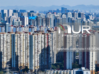 Densely packed residential buildings are seen in Nanjing, China, on November 29, 2024. (