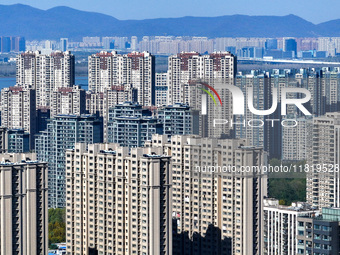 Densely packed residential buildings are seen in Nanjing, China, on November 29, 2024. (