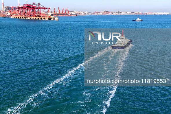 Auxiliary tugboats sail in the port area of Qingdao Port in Qingdao, China, on November 29, 2024. 