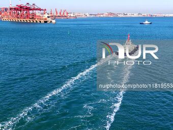 Auxiliary tugboats sail in the port area of Qingdao Port in Qingdao, China, on November 29, 2024. (