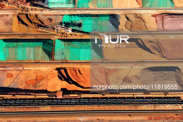 Imported iron ore is piled up at an iron ore yard in Qingdao Port in Qingdao, China, on November 29, 2024. 