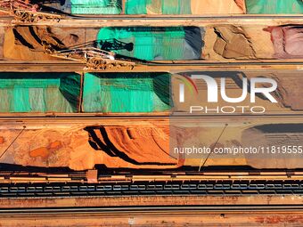 Imported iron ore is piled up at an iron ore yard in Qingdao Port in Qingdao, China, on November 29, 2024. (