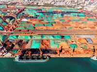 Imported iron ore is unloaded at a dock in Qingdao Port in Shandong province, China, on November 29, 2024. (