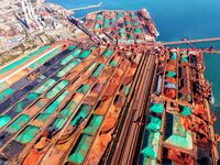 Imported iron ore is unloaded at a dock in Qingdao Port in Shandong province, China, on November 29, 2024. (