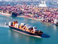 A cargo ship loaded with containers leaves the port of Qingdao in Qingdao, China, on November 29, 2024. (