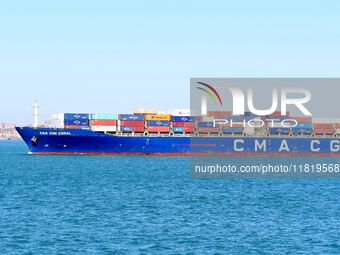 A fully loaded container ship enters the port of Qingdao in Qingdao, China, on November 29, 2024. (