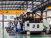 Workers produce shuttleless looms at a workshop in the West Coast New Area of Qingdao, Shandong province, China, on November 28, 2024. (