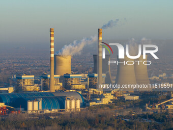 An aerial photo shows smoke from the chimney of the Huaneng Power plant in Huai 'an city, Jiangsu province, China, on November 29, 2024. (