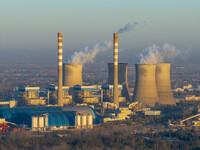 An aerial photo shows smoke from the chimney of the Huaneng Power plant in Huai 'an city, Jiangsu province, China, on November 29, 2024. (