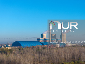 An aerial photo shows smoke from the chimney of the Huaneng Power plant in Huai 'an city, Jiangsu province, China, on November 29, 2024. (