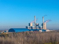 An aerial photo shows smoke from the chimney of the Huaneng Power plant in Huai 'an city, Jiangsu province, China, on November 29, 2024. (