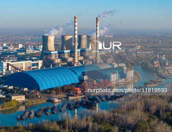 An aerial photo shows smoke from the chimney of the Huaneng Power plant in Huai 'an city, Jiangsu province, China, on November 29, 2024. 