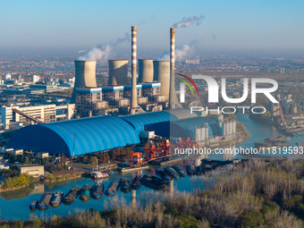 An aerial photo shows smoke from the chimney of the Huaneng Power plant in Huai 'an city, Jiangsu province, China, on November 29, 2024. (