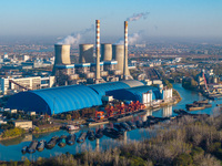 An aerial photo shows smoke from the chimney of the Huaneng Power plant in Huai 'an city, Jiangsu province, China, on November 29, 2024. (