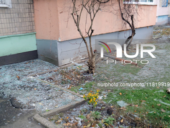 Glass shards cover the ground outside an apartment block damaged by an overnight Russian drone attack in the Dniprovskyi district of Kyiv, c...