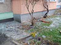 Glass shards cover the ground outside an apartment block damaged by an overnight Russian drone attack in the Dniprovskyi district of Kyiv, c...