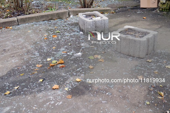 Glass shards cover the ground outside an apartment block damaged by an overnight Russian drone attack in the Dniprovskyi district of Kyiv, c...