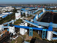 Electric coal loading operation takes place on the railway special line of Jiangxi Coal Reserve Center in Jiujiang, Jiangxi, China, on Novem...