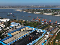 A bucket wheel machine works on a special railway line of the Jiangxi Coal Reserve Center in Jiujiang City, Jiangxi Province, China, on Nove...