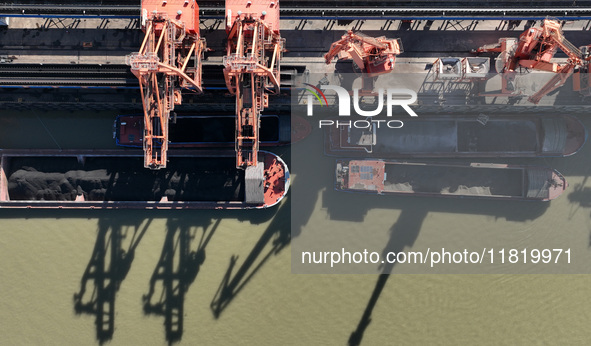 A cargo ship loaded with electric coal docks at the Yangtze River at the Jiangxi Coal and Carbon Reserve Center in Jiujiang City, Jiangxi Pr...