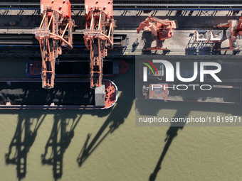 A cargo ship loaded with electric coal docks at the Yangtze River at the Jiangxi Coal and Carbon Reserve Center in Jiujiang City, Jiangxi Pr...