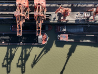 A cargo ship loaded with electric coal docks at the Yangtze River at the Jiangxi Coal and Carbon Reserve Center in Jiujiang City, Jiangxi Pr...