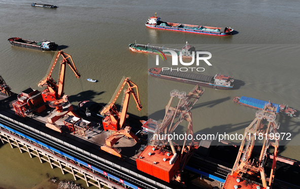 A cargo ship loaded with electric coal docks at the Yangtze River at the Jiangxi Coal and Carbon Reserve Center in Jiujiang City, Jiangxi Pr...