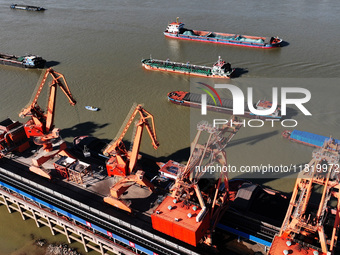 A cargo ship loaded with electric coal docks at the Yangtze River at the Jiangxi Coal and Carbon Reserve Center in Jiujiang City, Jiangxi Pr...