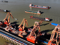 A cargo ship loaded with electric coal docks at the Yangtze River at the Jiangxi Coal and Carbon Reserve Center in Jiujiang City, Jiangxi Pr...