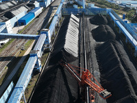 A bucket wheel machine works on a special railway line of the Jiangxi Coal Reserve Center in Jiujiang City, Jiangxi Province, China, on Nove...