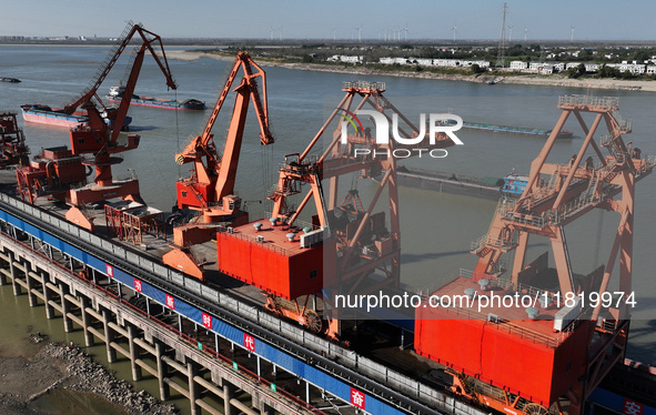 A cargo ship loaded with electric coal docks at the Yangtze River at the Jiangxi Coal and Carbon Reserve Center in Jiujiang City, Jiangxi Pr...