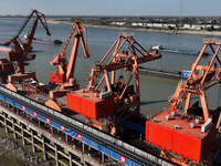 A cargo ship loaded with electric coal docks at the Yangtze River at the Jiangxi Coal and Carbon Reserve Center in Jiujiang City, Jiangxi Pr...