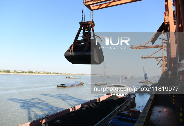 A cargo ship loaded with electric coal docks at the Yangtze River at the Jiangxi Coal and Carbon Reserve Center in Jiujiang City, Jiangxi Pr...