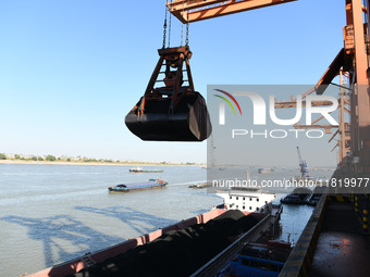 A cargo ship loaded with electric coal docks at the Yangtze River at the Jiangxi Coal and Carbon Reserve Center in Jiujiang City, Jiangxi Pr...