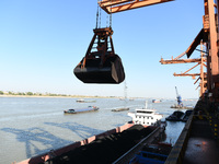 A cargo ship loaded with electric coal docks at the Yangtze River at the Jiangxi Coal and Carbon Reserve Center in Jiujiang City, Jiangxi Pr...