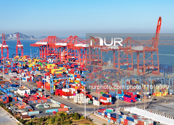 The photo shows the working scene of a container terminal at Lianyungang Port in Jiangsu province, China, on November 29, 2024. 