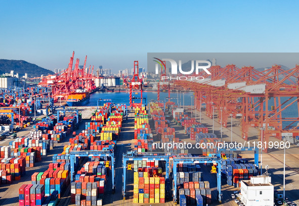 The photo shows the working scene of a container terminal at Lianyungang Port in Jiangsu province, China, on November 29, 2024. 