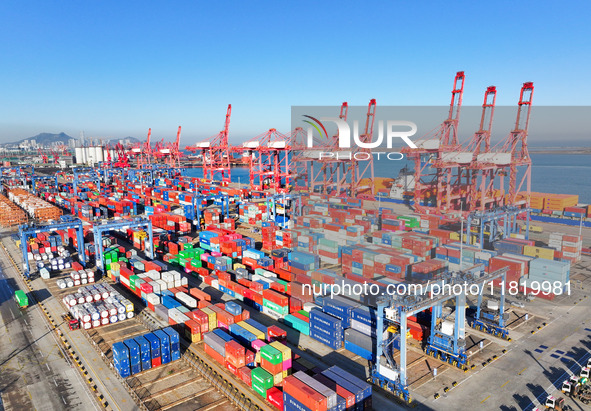 The photo shows the working scene of a container terminal at Lianyungang Port in Jiangsu province, China, on November 29, 2024. 