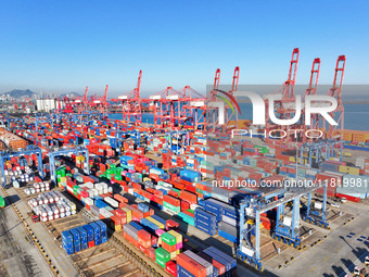 The photo shows the working scene of a container terminal at Lianyungang Port in Jiangsu province, China, on November 29, 2024. (