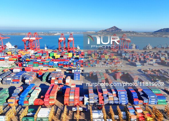 The photo shows the working scene of a container terminal at Lianyungang Port in Jiangsu province, China, on November 29, 2024. 