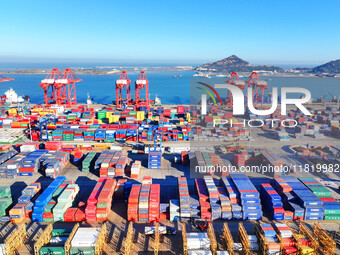 The photo shows the working scene of a container terminal at Lianyungang Port in Jiangsu province, China, on November 29, 2024. (