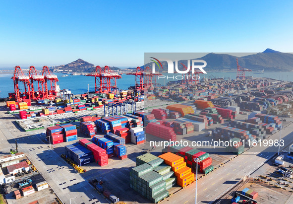 The photo shows the working scene of a container terminal at Lianyungang Port in Jiangsu province, China, on November 29, 2024. 