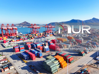 The photo shows the working scene of a container terminal at Lianyungang Port in Jiangsu province, China, on November 29, 2024. (