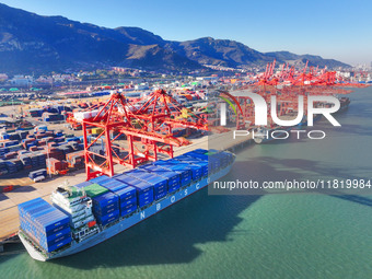 The photo shows the working scene of a container terminal at Lianyungang Port in Jiangsu province, China, on November 29, 2024. (