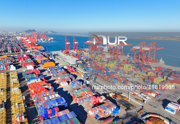 The photo shows the working scene of a container terminal at Lianyungang Port in Jiangsu province, China, on November 29, 2024. 