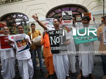 Monks of ISKCON (International Society of Krishna Consciousness) and Hindu devotees in Kolkata, India, hold a protest against the recent arr...