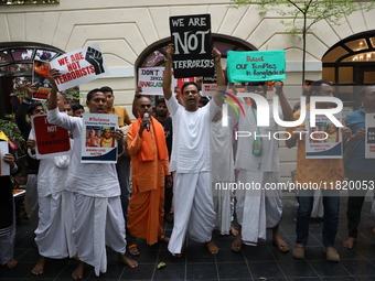 Monks of ISKCON (International Society of Krishna Consciousness) and Hindu devotees in Kolkata, India, hold a protest against the recent arr...